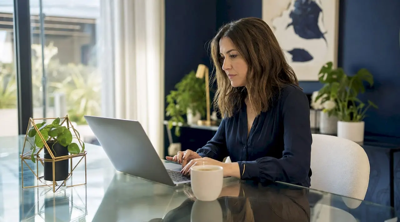 Small business owner managing CMS content at desk