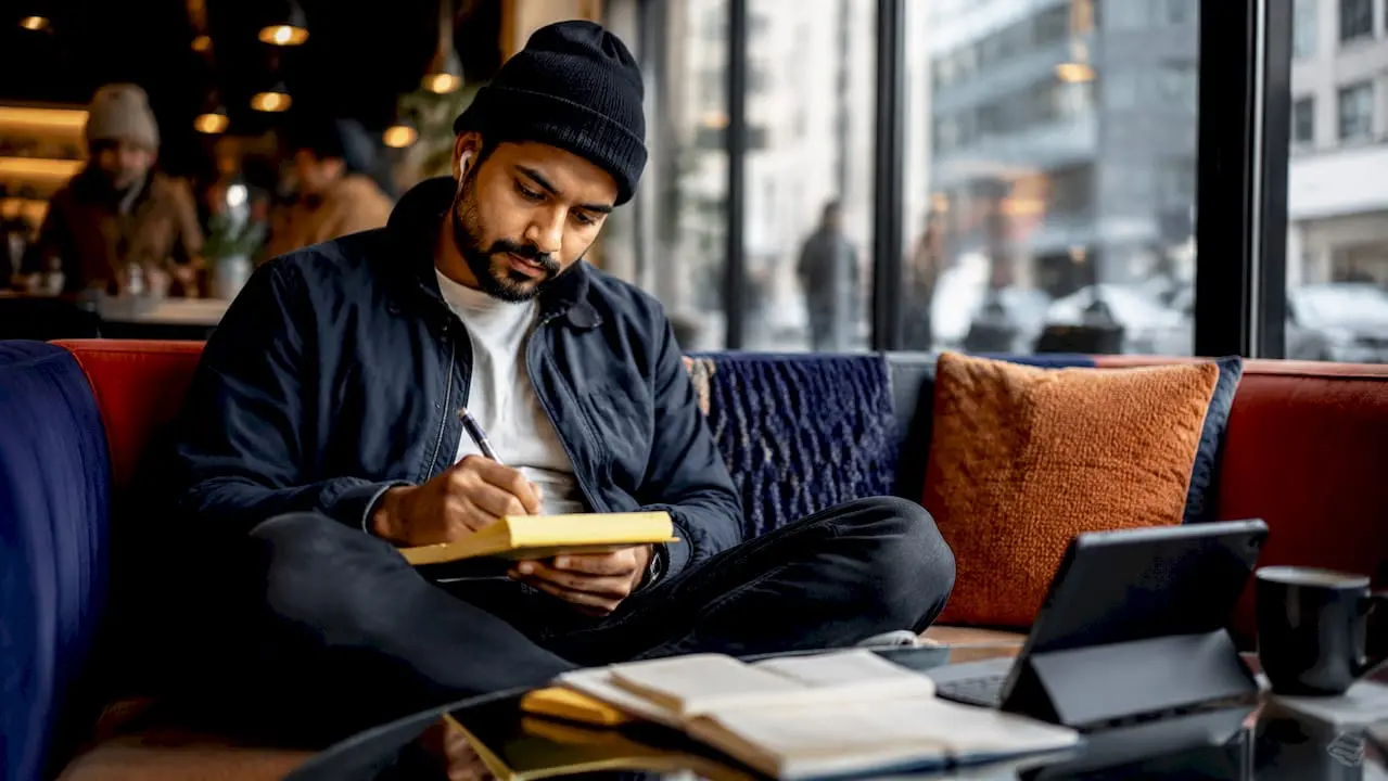 Man taking notes for help centre content