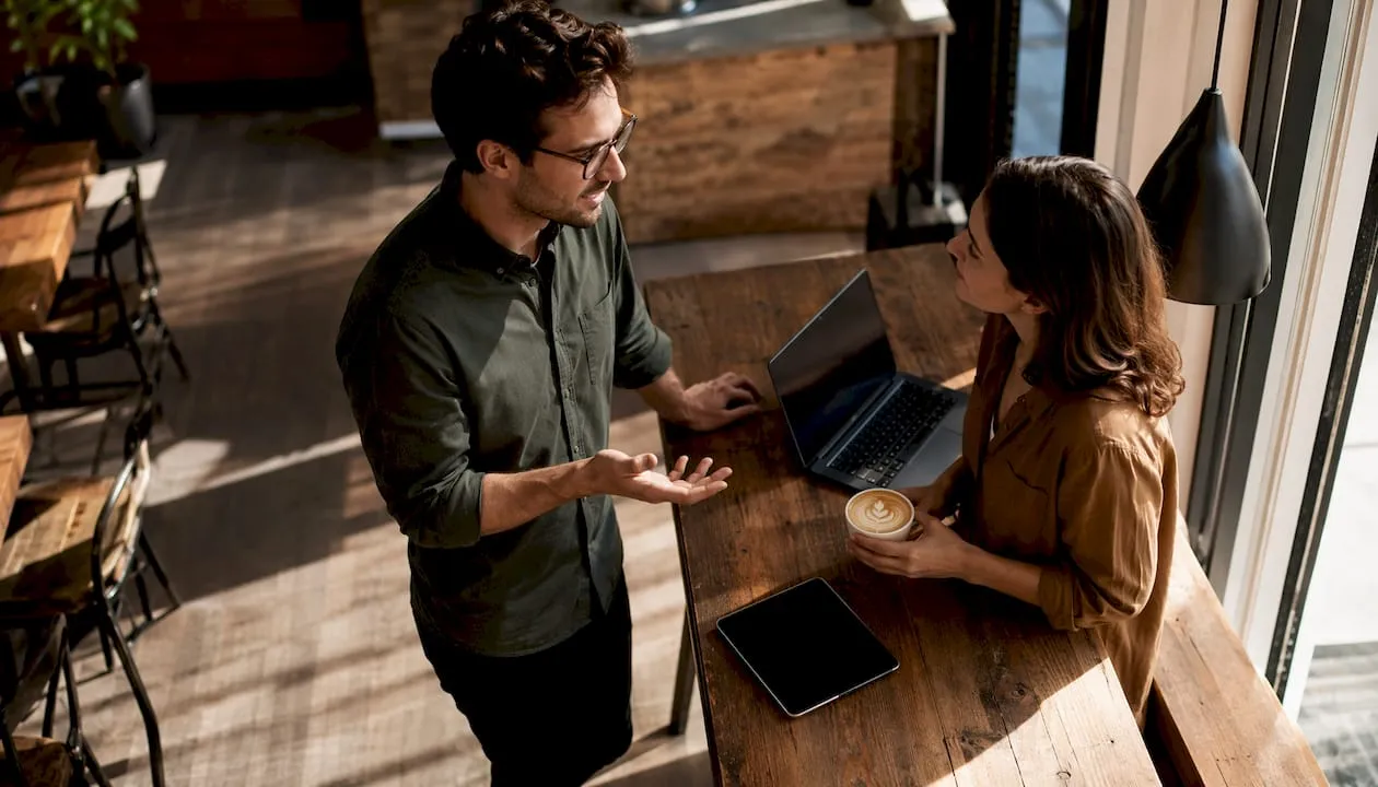 Two colleagues discussing payment gateways